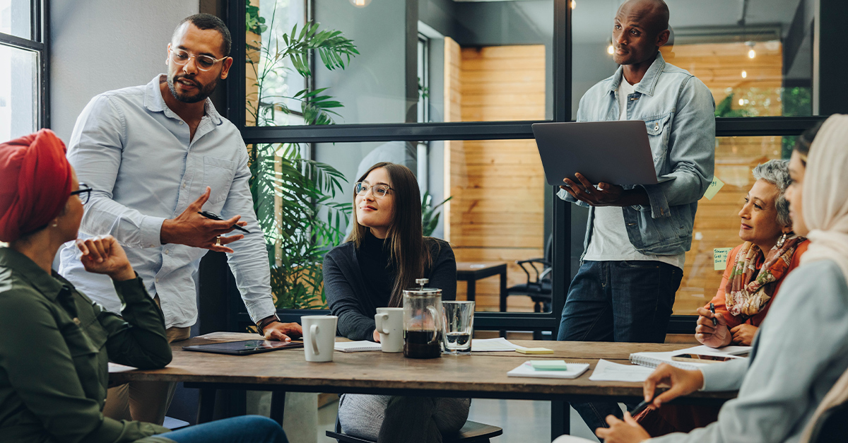 Team of multicultural business people sharing ideas during a meeting in a modern office