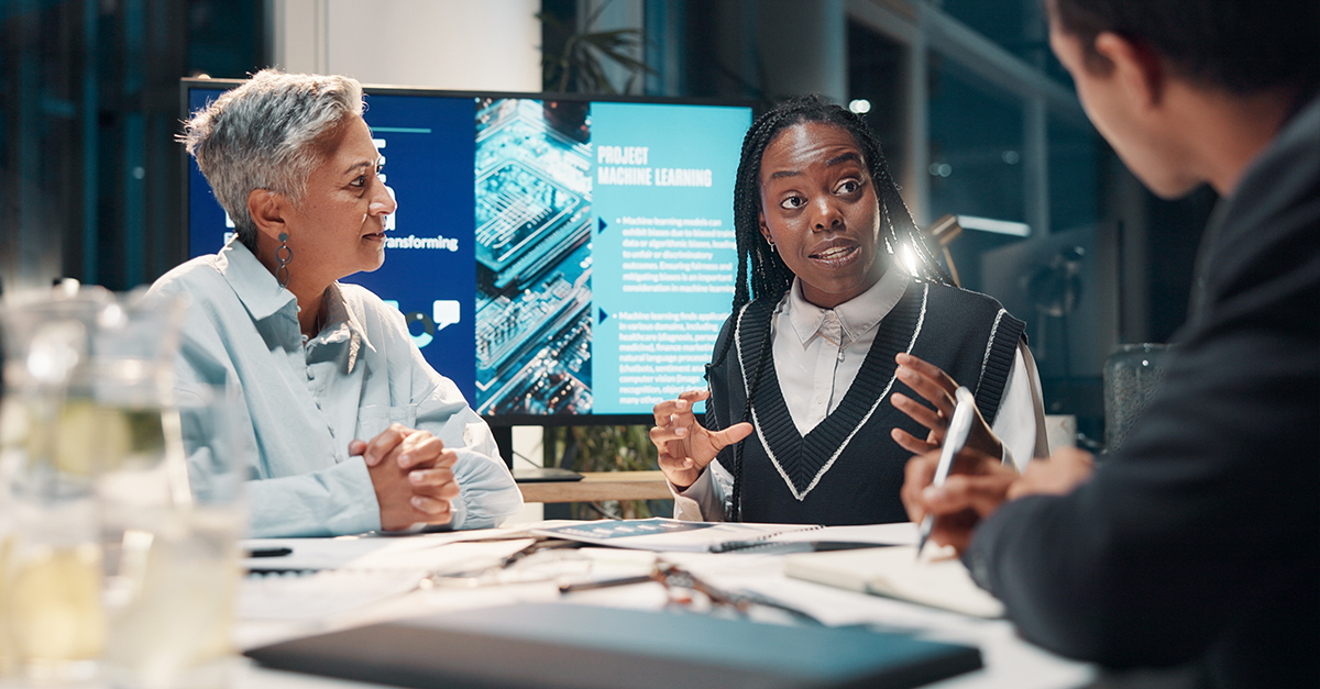 International workplace team meeting and discussion of upcoming project on machine learning.