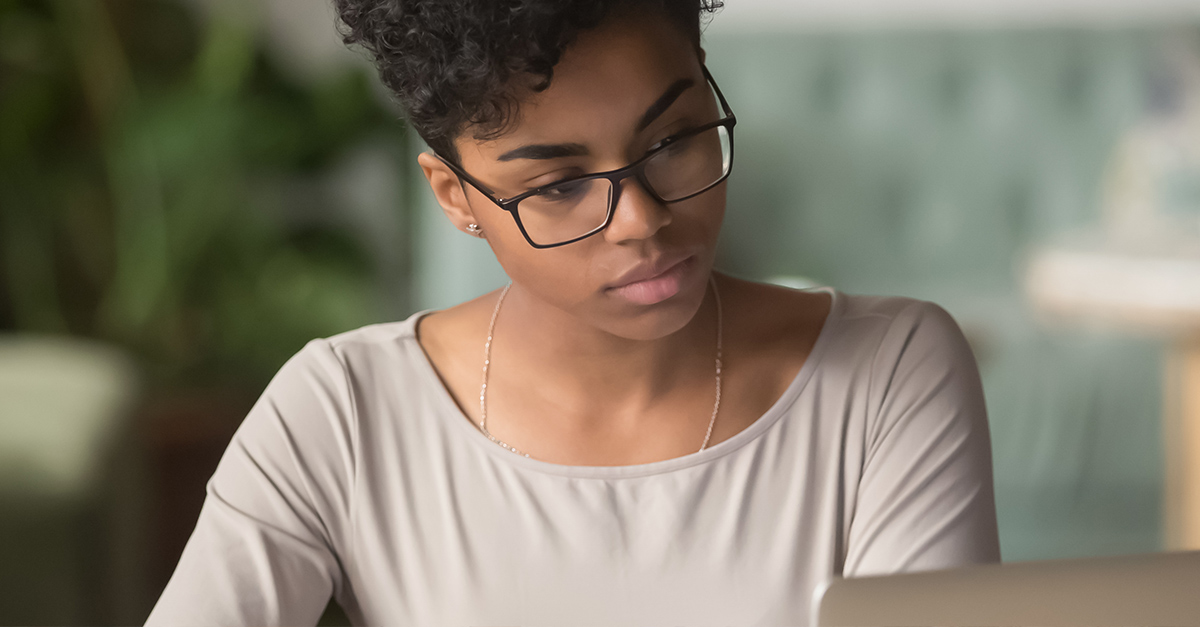 Young professional watching YouTube channels on her laptop to learn Spanish for business