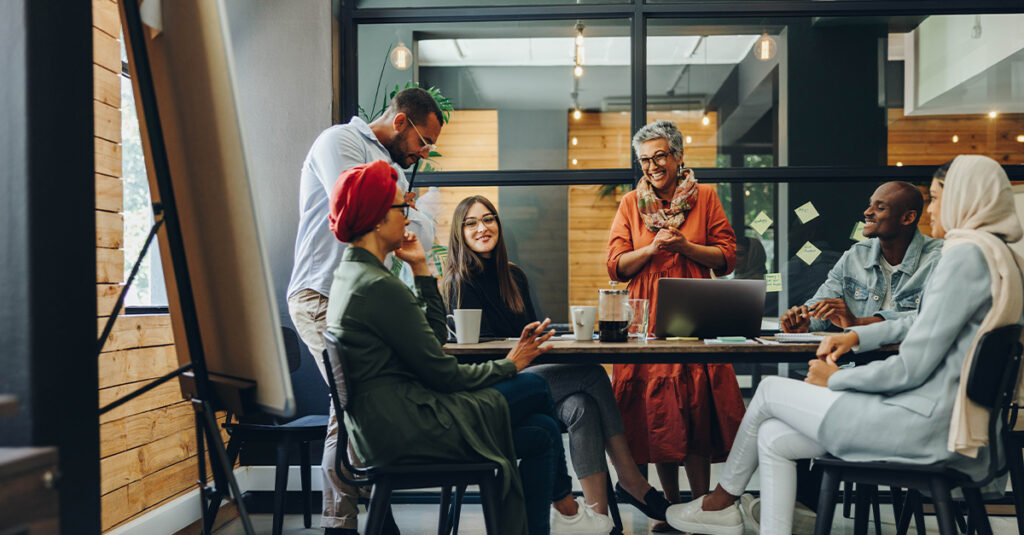 Group of successful business professionals working as a team in a multicultural workplace.