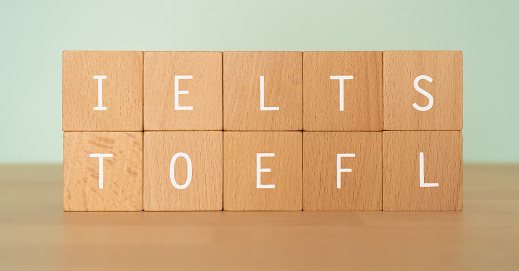 Wooden blocks with "IELTS TOEFL" text