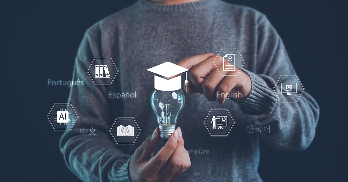 Cropped image of a man holding a light bulb with graduation cap icon and global language symbols, representing online education, AI learning, digital training, and multilingual e-learning innovation.